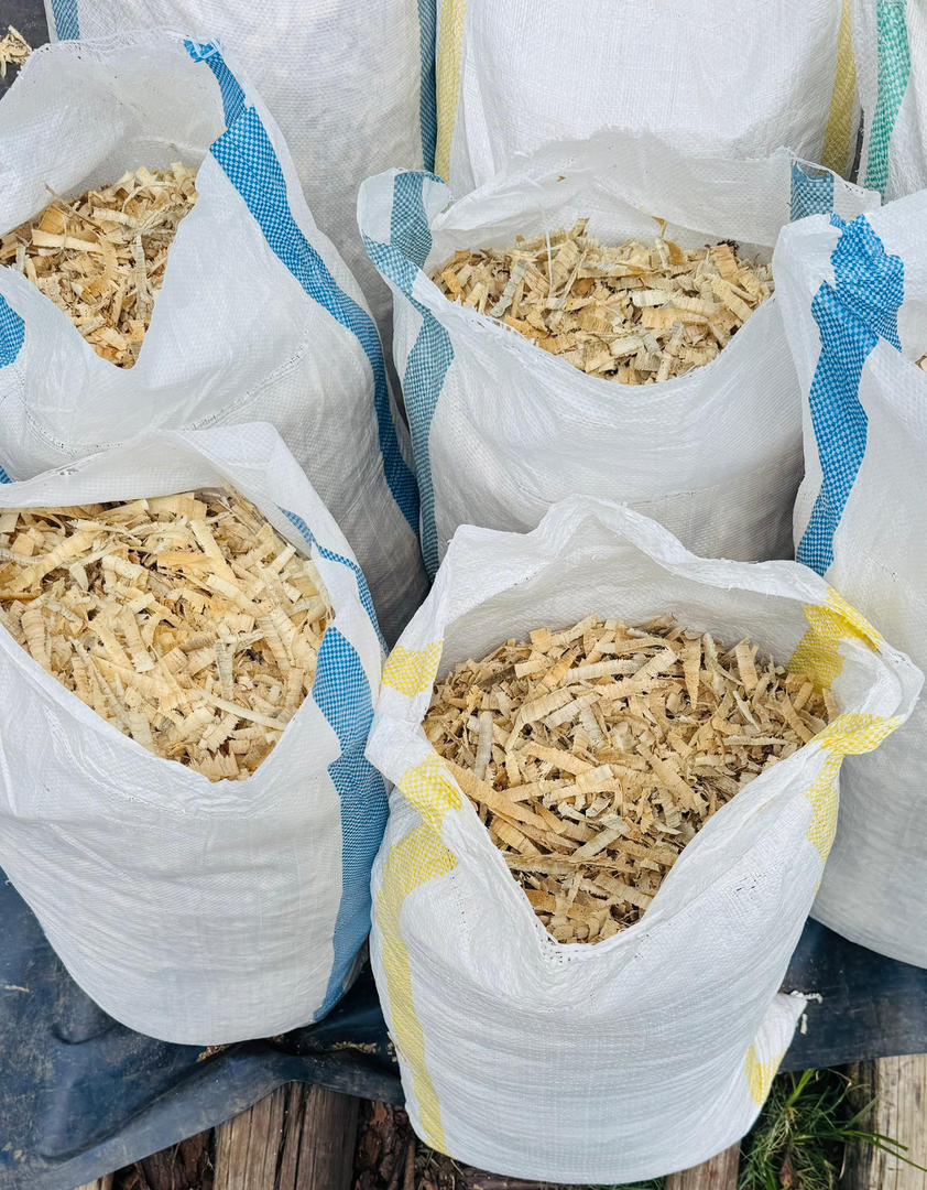 Open bags showing high quality pine wood shavings inside